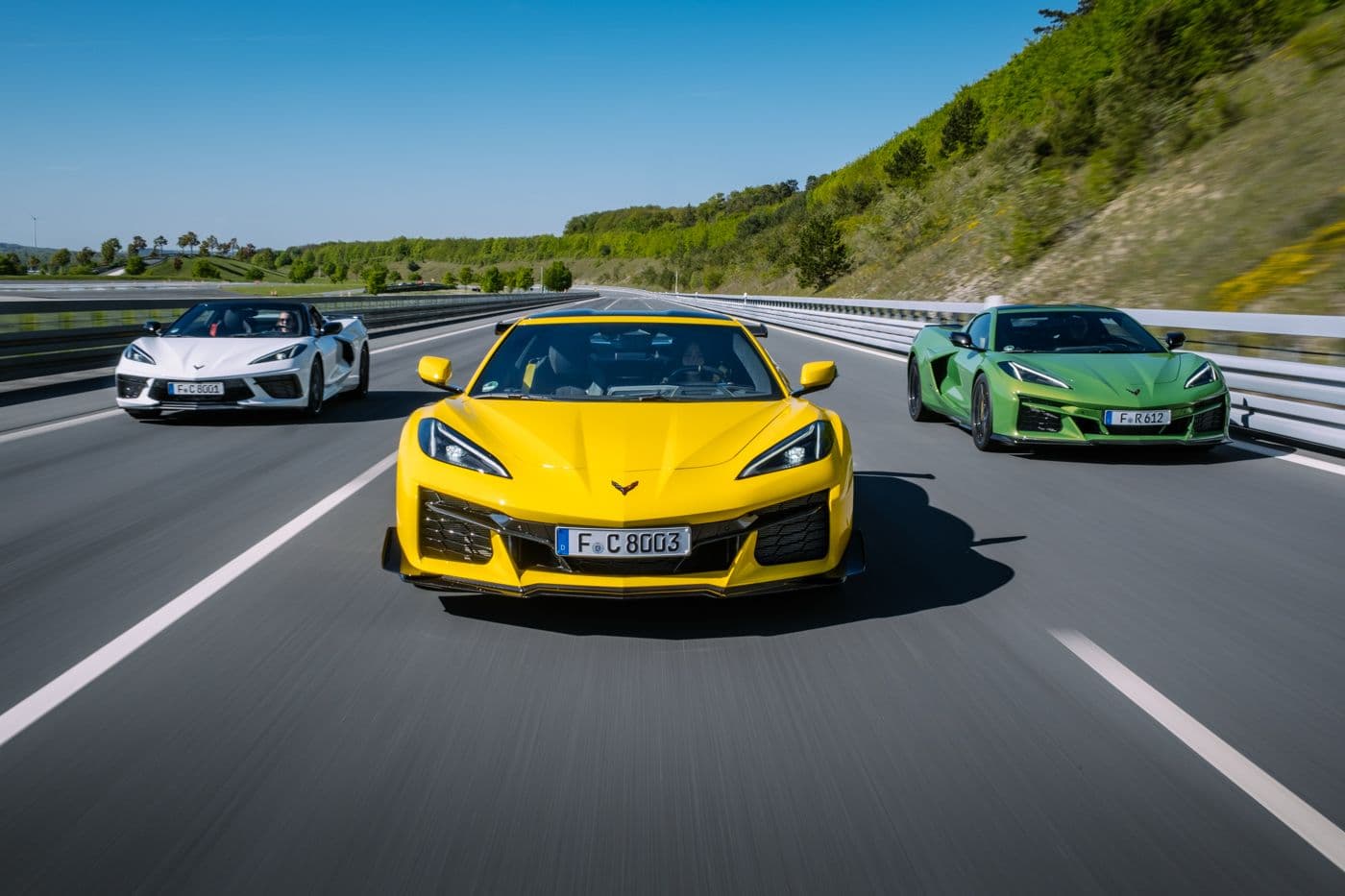 Chevrolet Corvette Model Year 2026 — three C8 models on the open road, photographed by Mario Brunner